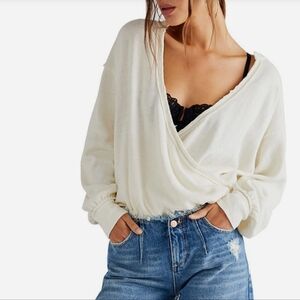 Women's cream anyway plunge neck long sleeve Free People sweater.
